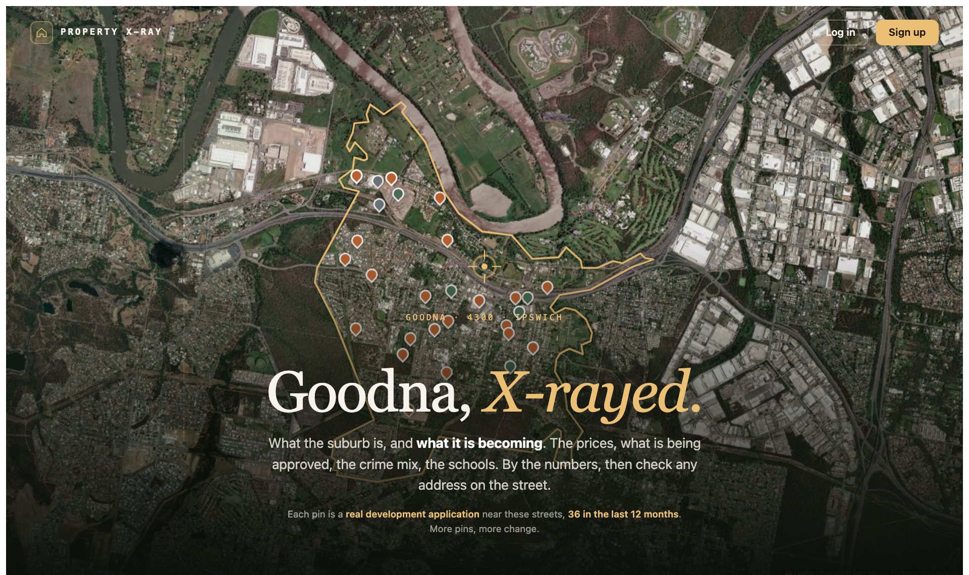 Satellite map of Goodna in Ipswich with the suburb boundary traced in gold beside the Brisbane River, and pins marking the 36 development applications lodged near its streets in the last 12 months.