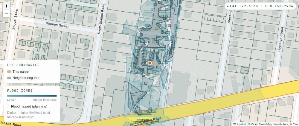 Map of Booval with the council flood overlay shaded in blue-grey. The shading covers the run of parcels on one side of Bergin Street and stops at the road, leaving the parcels on the opposite side unshaded. A pin marks 8 Bergin Street on the shaded side.