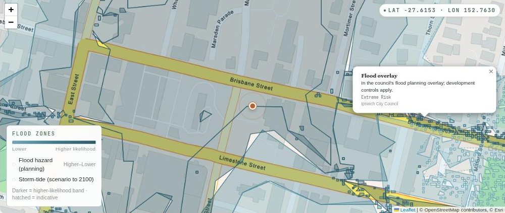 Map of the Ipswich city centre either side of Brisbane Street with the council flood overlay shaded over it in blue-grey, darker on some blocks than others, and an open information box reading Flood overlay, in the council's flood planning overlay, Extreme Risk, Ipswich City Council.