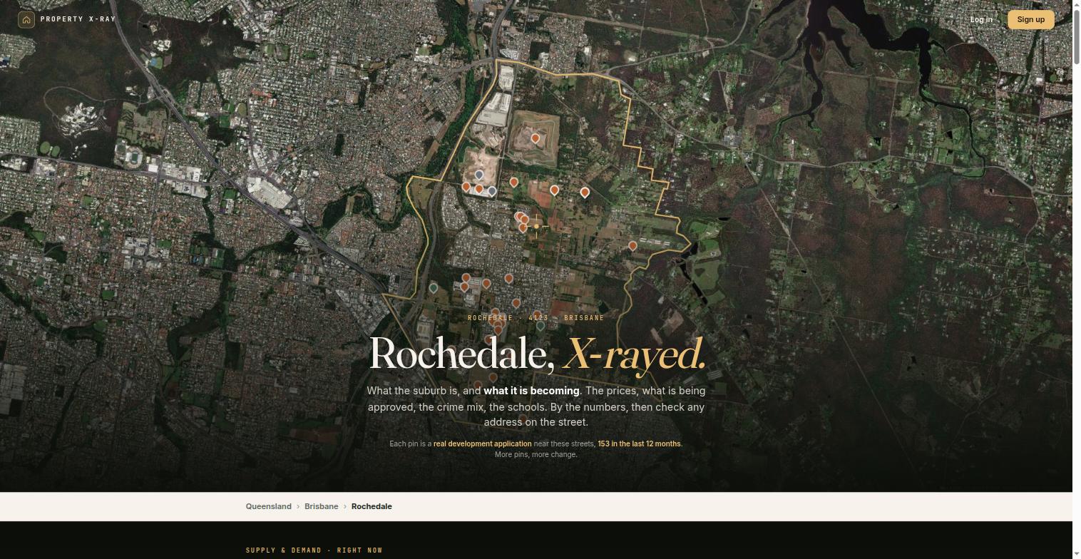 Development application map of Rochedale in Brisbane, an aerial view with a large suburb boundary outlined in gold enclosing paddocks, bushland and a construction quarry, with application pins scattered thinly across roughly a third of the area.
