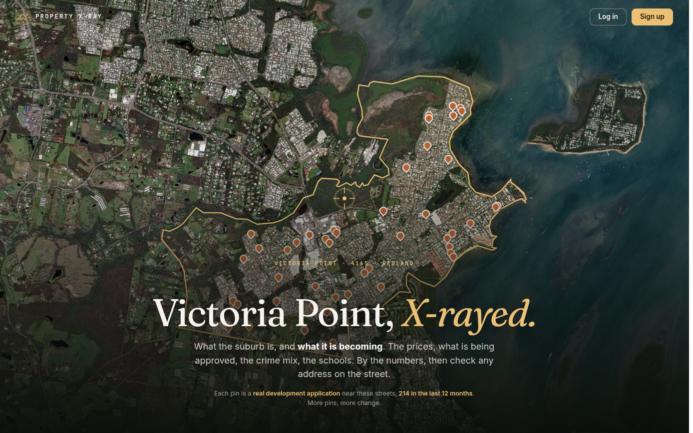 Aerial view of Victoria Point on the Victoria Point suburb page at propertyxray.com.au, with the suburb boundary traced in gold and orange pins marking 214 development applications lodged near its streets in the last 12 months.